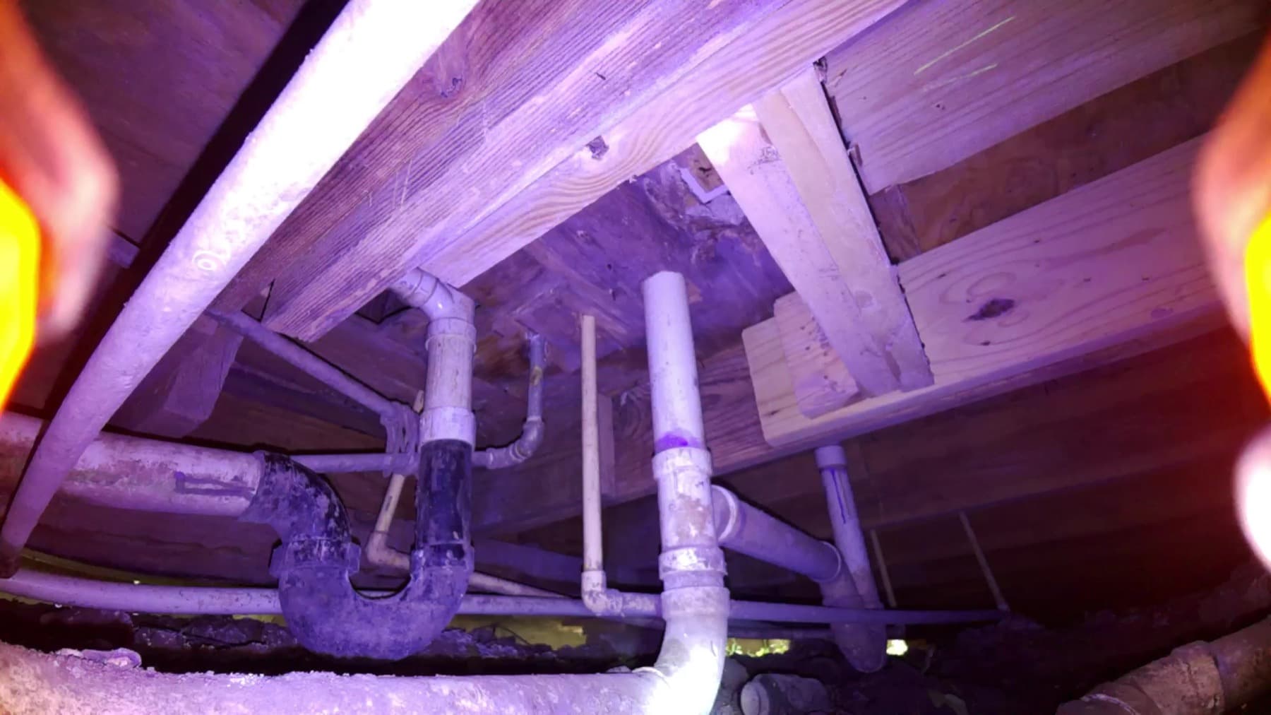 Rover photo showing close crawlspace wood framing detail near a pier